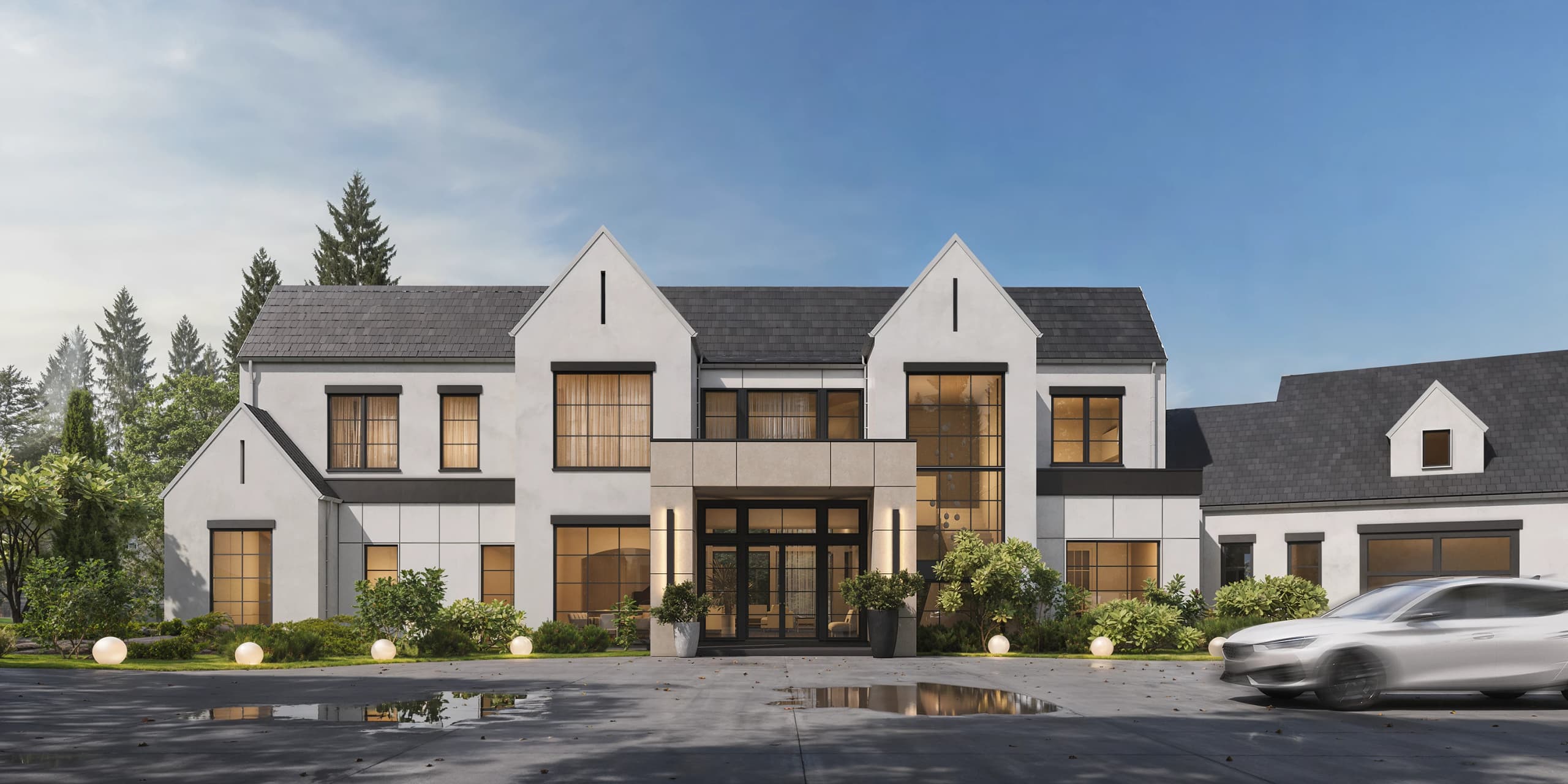 A Zaboss Concepts custom home on a wooded parcel at golden hour